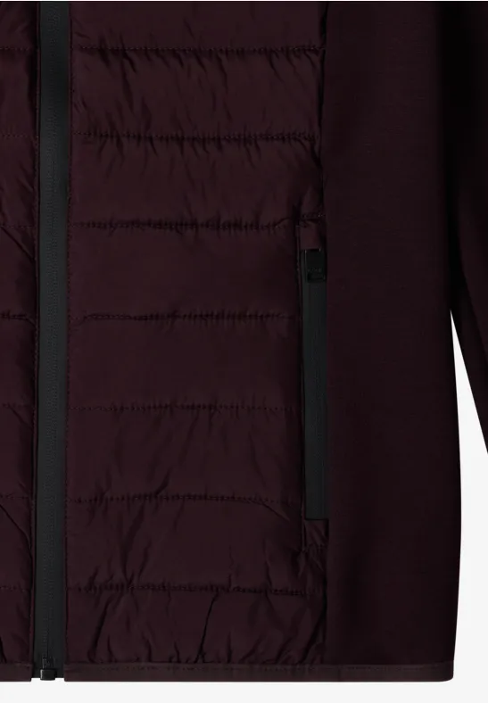 Veste bordeaux à face avant matelassée, poche zippée et manches ainsi que côtés en tissu doux