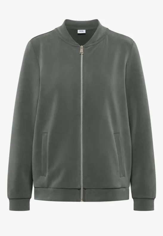 Olivgrüne Samtbomberjacke mit Reißverschluss und seitlichen Taschen.