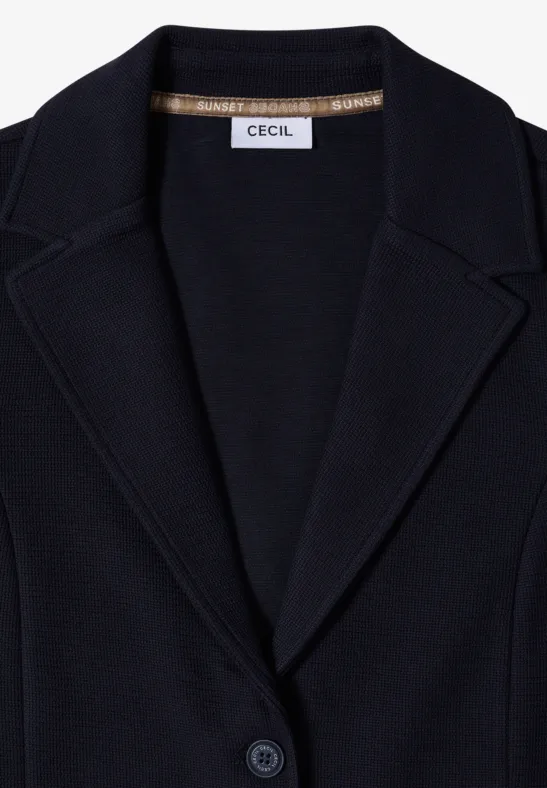 Blazer bleu foncé avec col à revers, un bouton et étiquette 'Cecil' à l'intérieur.
