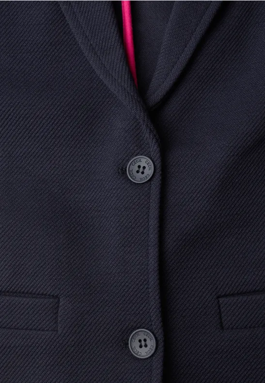 Dunkelblauer Blazer mit dezenter Struktur, zwei Knöpfen und rotem Innenfutter.