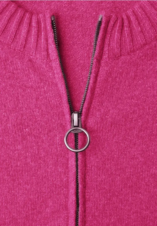 Knallpinkes Strickoberteil mit Reißverschluss und rundem Ring-Zipper.