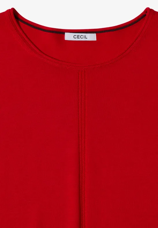 Top rouge pour femme, encolure arrondie, couture centrale apparente et étiquette 'Cecil'.