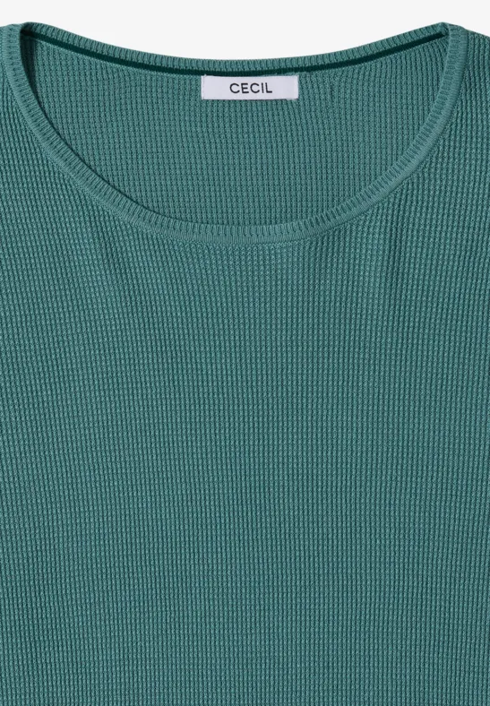 T-shirt femme vert sapin finement côtelé, col rond, plié à plat.