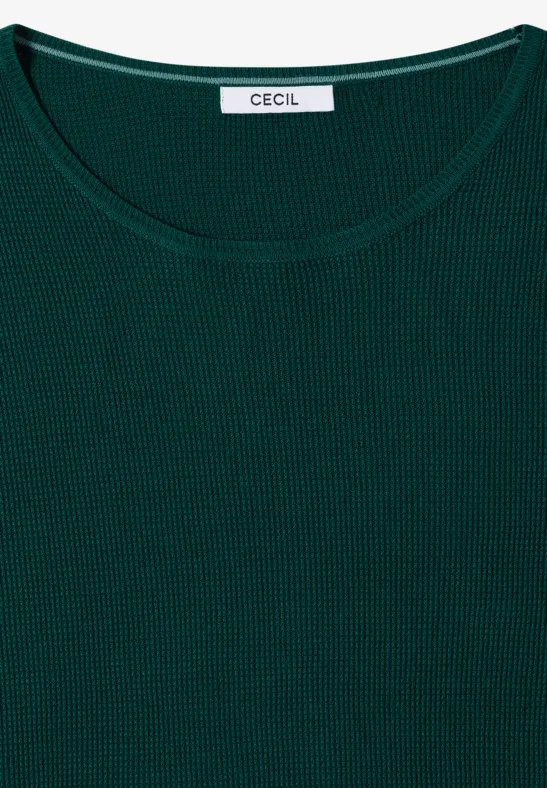 Zielony, wafelkowy longsleeve z okrągłym dekoltem i metką CECIL, złożony na płasko.