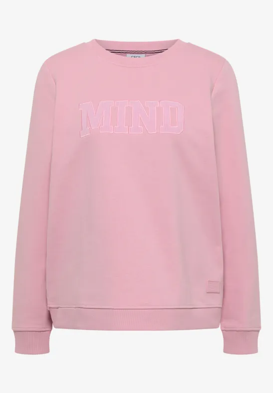 Sweat rose à col rond avec l'inscription blanche 'MIND' sur la poitrine.