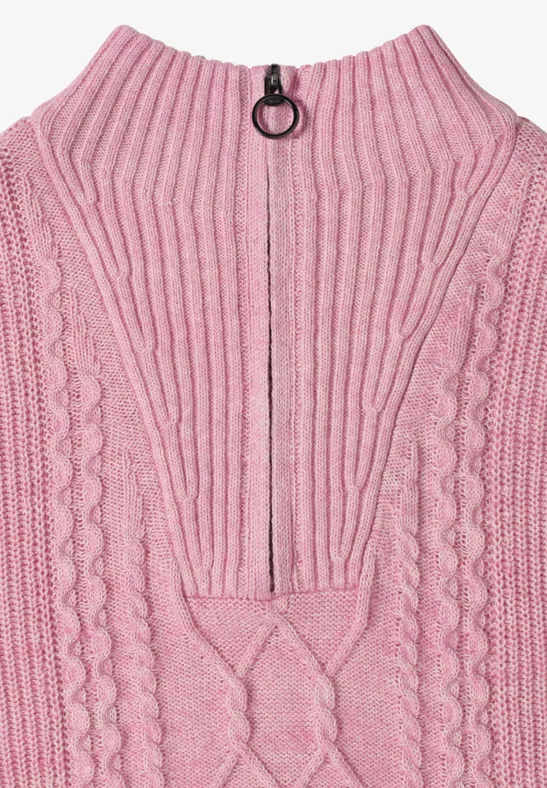 Pull en maille rose avec fermeture éclair et anneau au col.