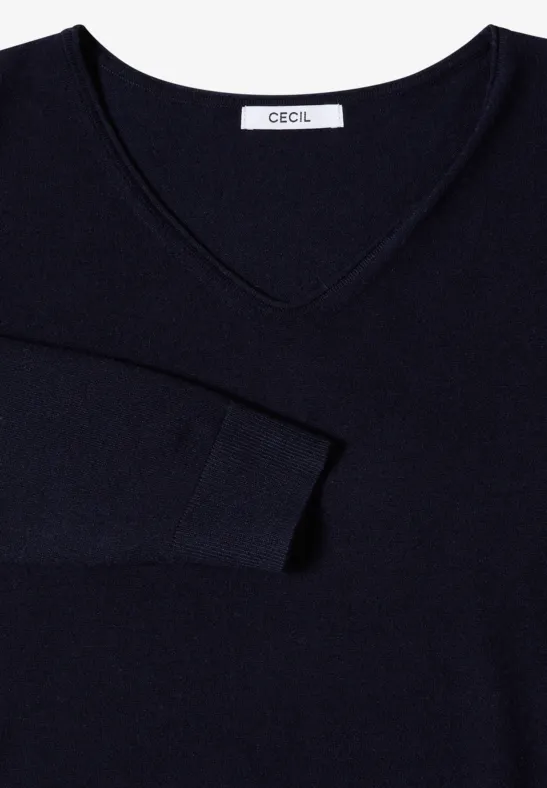 Pull bleu marine à col en V, manches ajustées et étiquette CECIL.