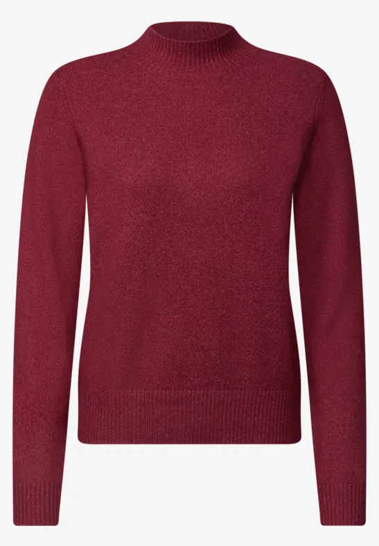 Pull femme rouge uni à col rond et finitions côtelées, style épuré.