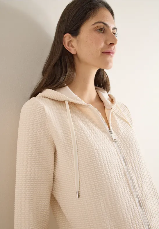 Jas met capuchon en structuur pearl beige