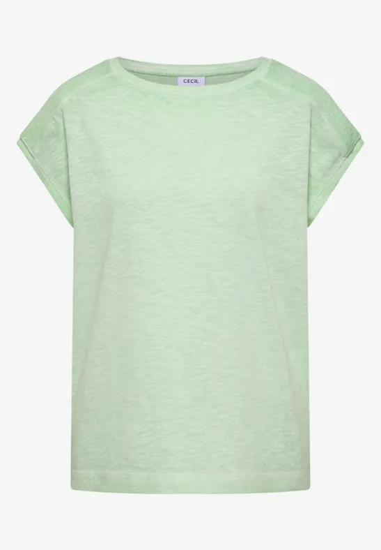 T-shirt ample couleur vert menthe clair, manches tombantes et encolure ronde.