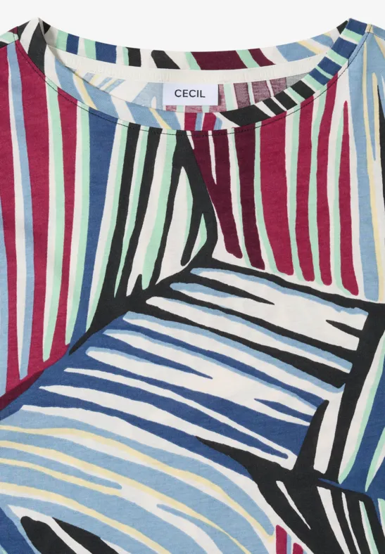 Buntes, abstrakt gestreiftes Damenshirt mit wechselnden Linien in Blau, Grün, Rot und Schwarz auf hellem Grund.