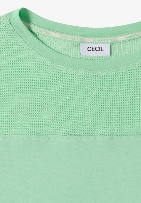 Hellgrünes Oberteil mit Netzstoff im oberen Bereich und CECIL-Label am Rundhalsausschnitt.