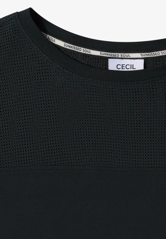 Zwart damesshirt met meshstuk boven de borst en "CECIL" label in de nek.