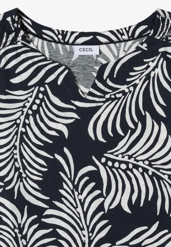Un T-shirt bleu foncé à imprimé feuilles blanches de la marque CECIL