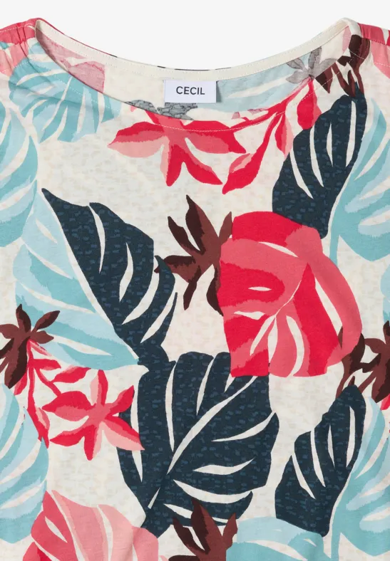 Top sans manches blanc pour femme avec imprimé tropical de fleurs et de feuilles en rouge, bleu et rose.