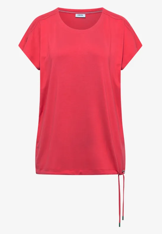 T-shirt rouge ample à manches courtes, encolure ronde et cordon latéral au bas du vêtement.