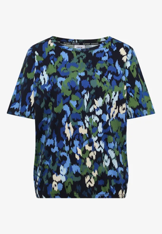 T-shirt manches courtes à motif floral abstrait bleu, vert, noir et blanc.