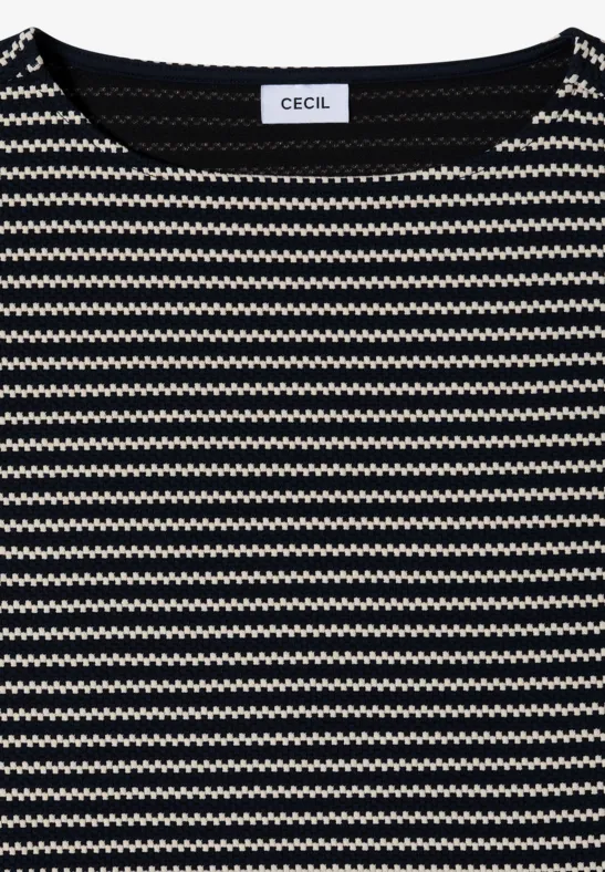 Opgevouwen shirt met zwart-wit zigzagpatroon en ronde hals.