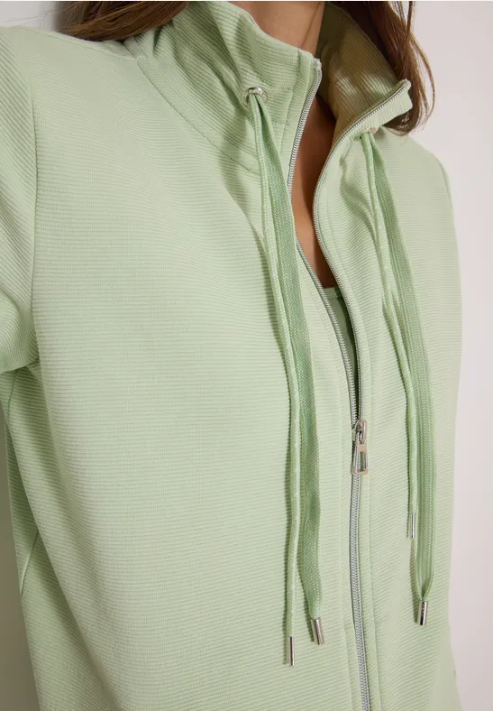 Hellgrüner Hoodie mit halbem Reißverschluss und Kordelzug am Stehkragen, schmale Passform