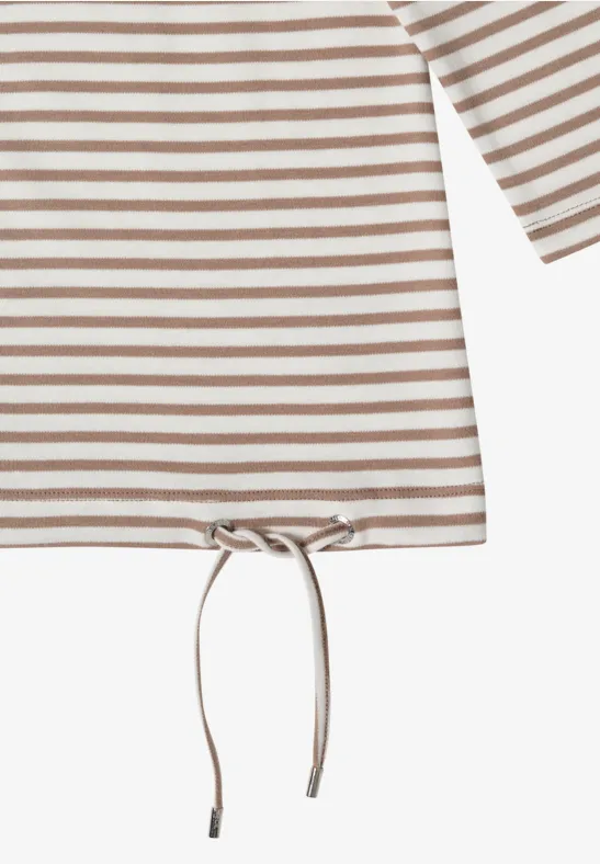 Haut à manches longues rayé beige et blanc avec coulisse et cordon au bas.