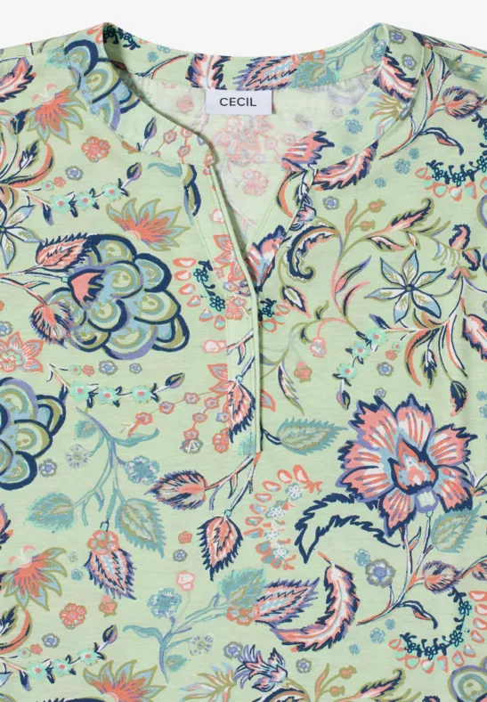 Hellgrüne Bluse mit buntem Blumenmuster, V-Ausschnitt und lockerer Passform.