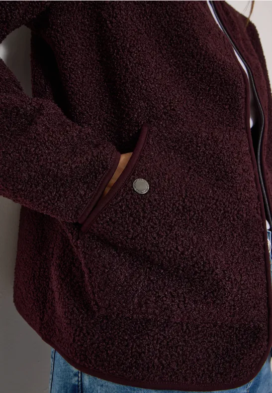 Burgunderroter, melierter Fleece-Mantel mit Reißverschluss und seitlicher Tasche mit Druckknopf.
