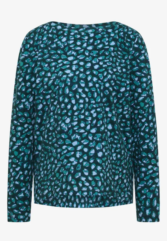 Haut à manches longues motif abstrait turquoise et noir.