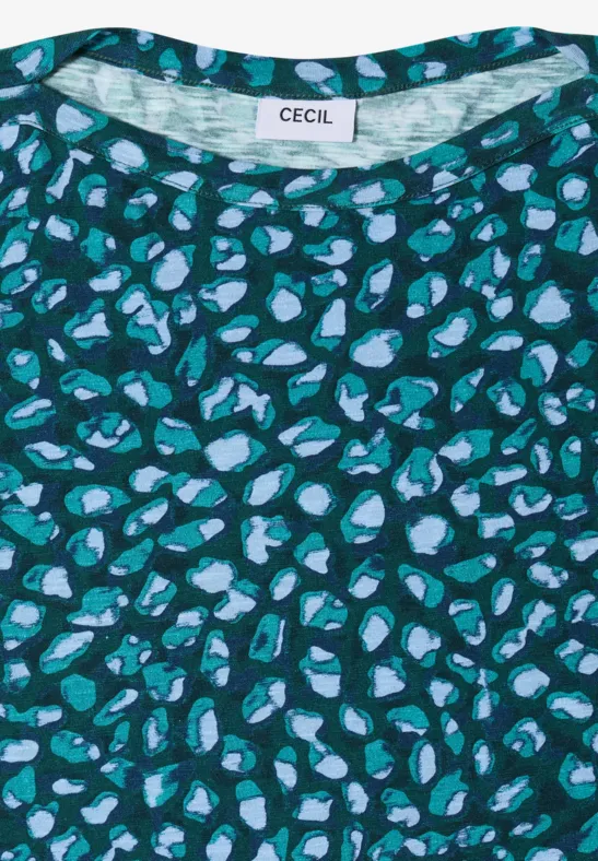 T-shirt vert avec motif abstrait de taches bleu clair et turquoise.