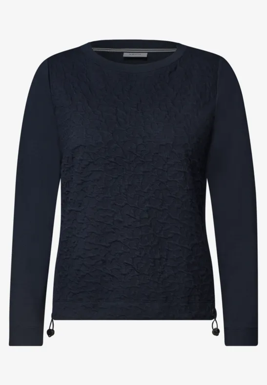Dunkelblaues Shirt mit Langarm, Textur-Front und seitlichen Kordel-Details am Saum.