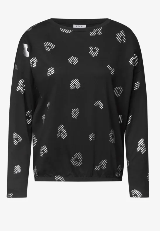 Schwarzes Langarmshirt mit locker verteiltem, weißem Punktemuster.