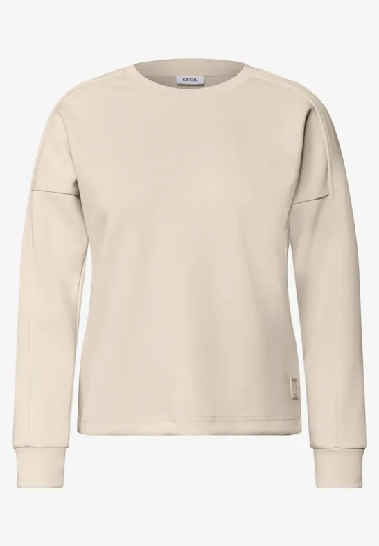 Beiges Sweatshirt mit langen Ärmeln und Rundhalsausschnitt.