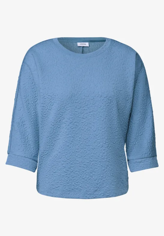 Pull bleu clair à manches 3/4 et col rond.