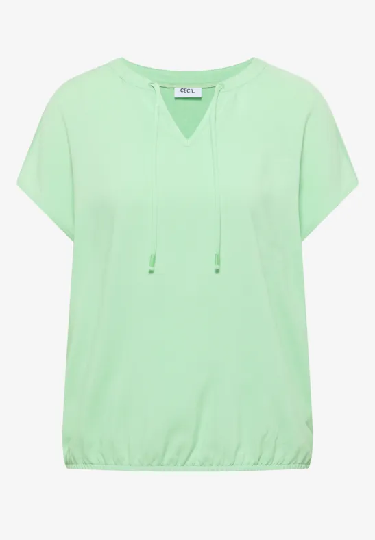 Lichtgroen, losvallend T-shirt met korte mouwen, koordsluiting bij de hals en elastische zoom.