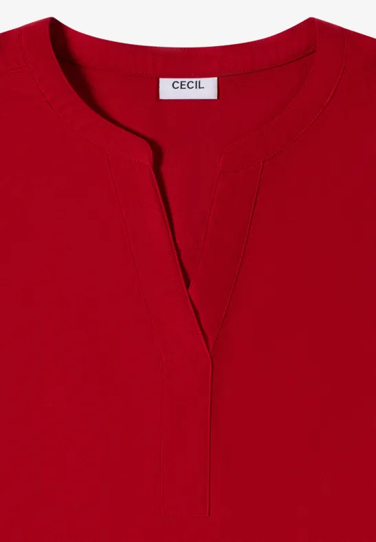 Rotes Damen-Shirt mit Rundhalsausschnitt und V-förmigem Schlitz, schlicht geschnitten.