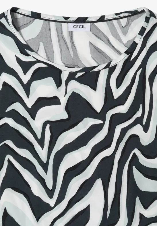 Ärmelloses Top mit schwarz-weißem Zebrastreifenmuster.