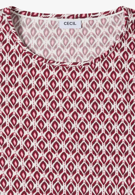 Mouwloos rood topje met wit geometrisch ruitpatroon