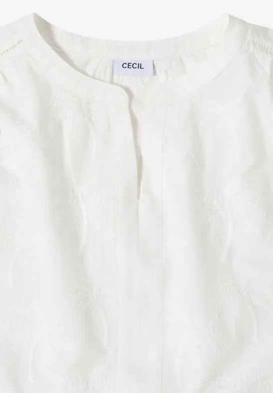 Weißes ärmelloses Oberteil mit Rundhalsausschnitt und feiner Struktur.