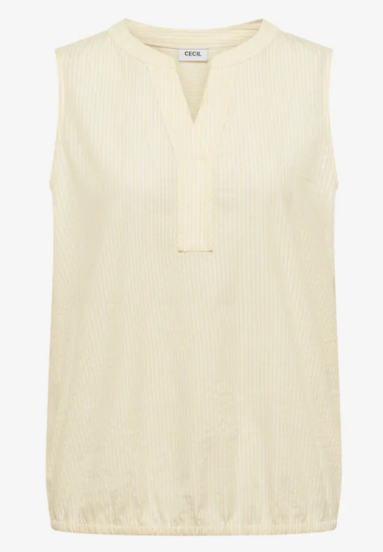 Ärmellose, cremefarbene Bluse mit V-Ausschnitt und feiner Struktur.