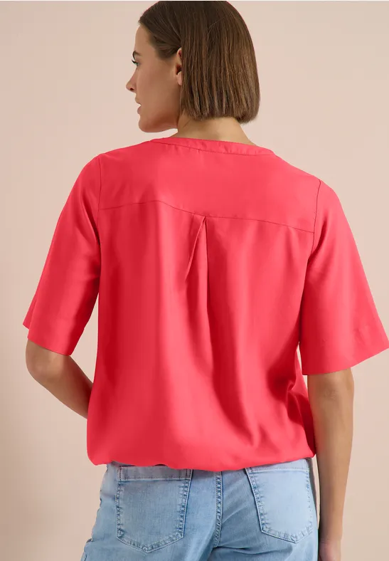 Blouse met korte mouwen en gespleten hals coral