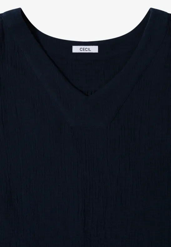 Schlichtes schwarzes ärmelloses Top mit V-Ausschnitt und dezitem Label innen.
