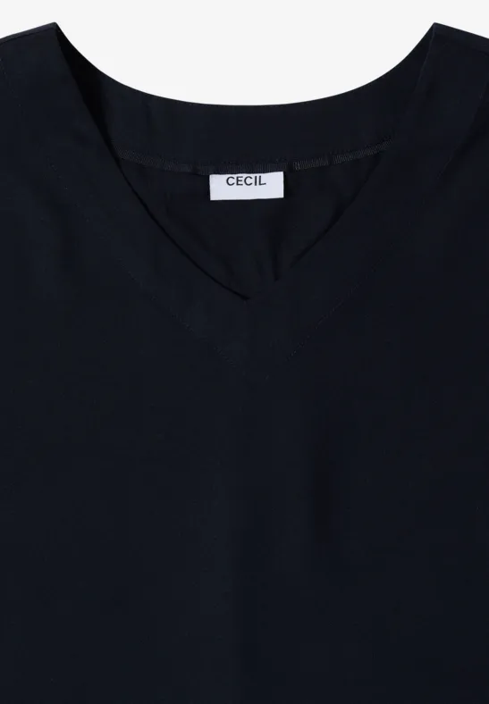 Zwart mouwloos V-hals topje met CECIL-label.