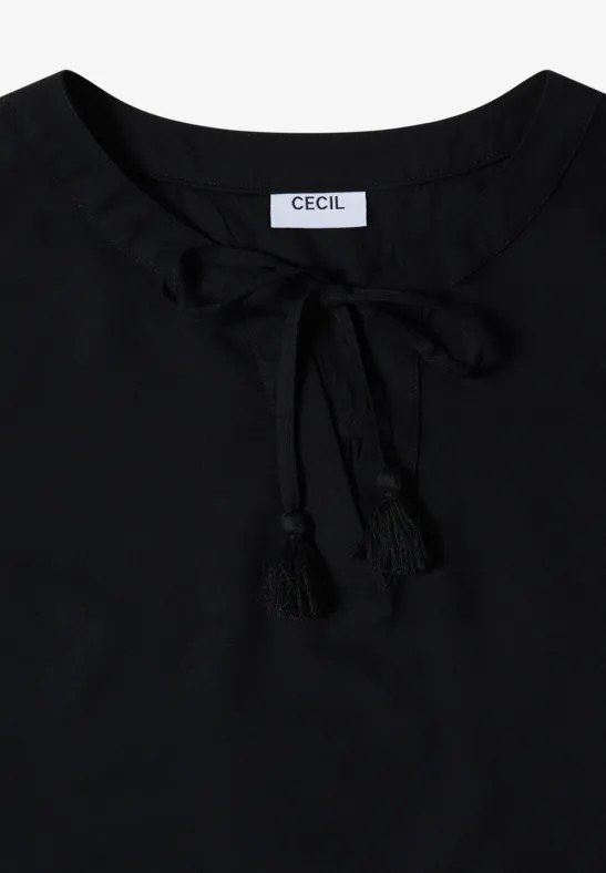 Schwarzes Damenoberteil mit Schnürung und Quasten am Ausschnitt.