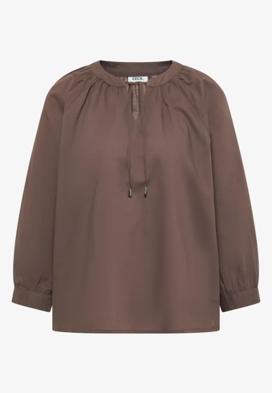Braune Bluse mit langen Ärmeln und Bindeband am Ausschnitt.