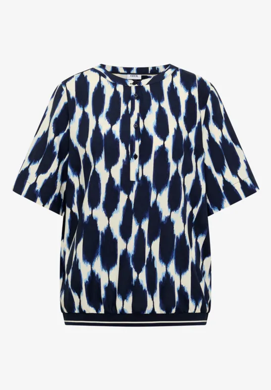 Weiß-blau gemustertes Kurzarmshirt mit rundem Ausschnitt und Knopfleiste.