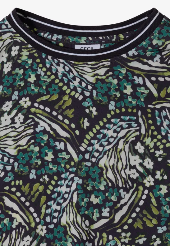 Schwarzes Shirt mit abstraktem Muster aus weißen Linien und kleinen türkis-grünen Blüten.
