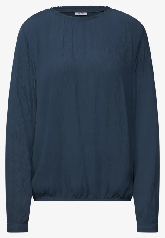 Blouse bleu foncé à manches longues, encolure ronde et ourlet légèrement froncé
