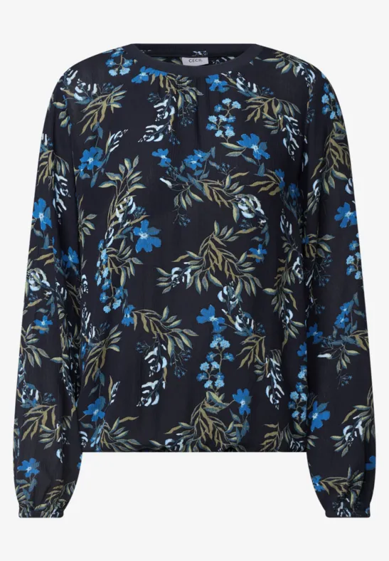 Schwarze Bluse mit langen Ärmeln und blau-grünem Blumenmuster.