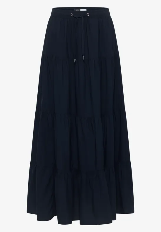 Jupe longue bleu marine à volants en tissu léger avec taille élastiquée et cordon de serrage.