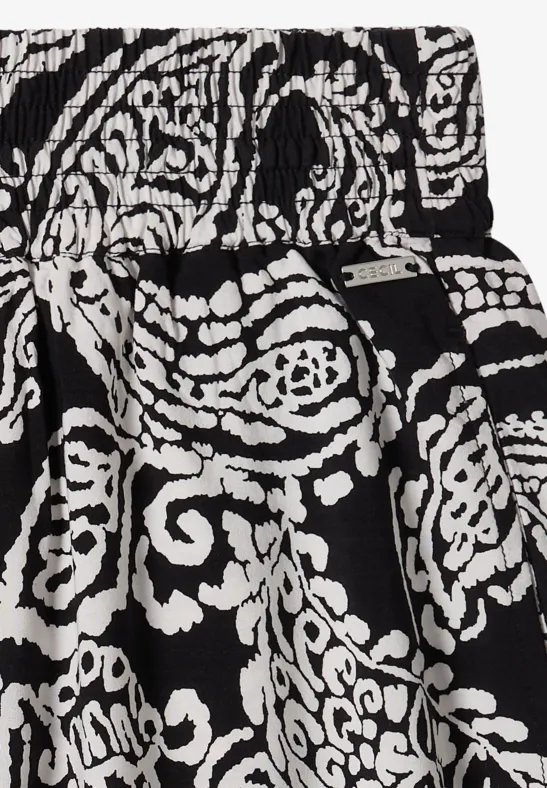 Schwarz-weiß gemusterter Rock mit floralen Paisley-Motiven und elastischem Bund.