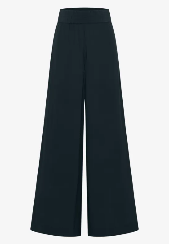 Zwarte wijde broek met hoge taille en uitlopende pijpen.
